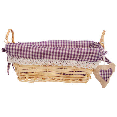 Wicker basket with a purple checkered fabric liner and matching heart-shaped tag on a white background