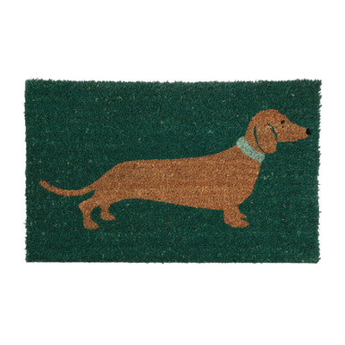 Doormat with a dachshund design on a green background