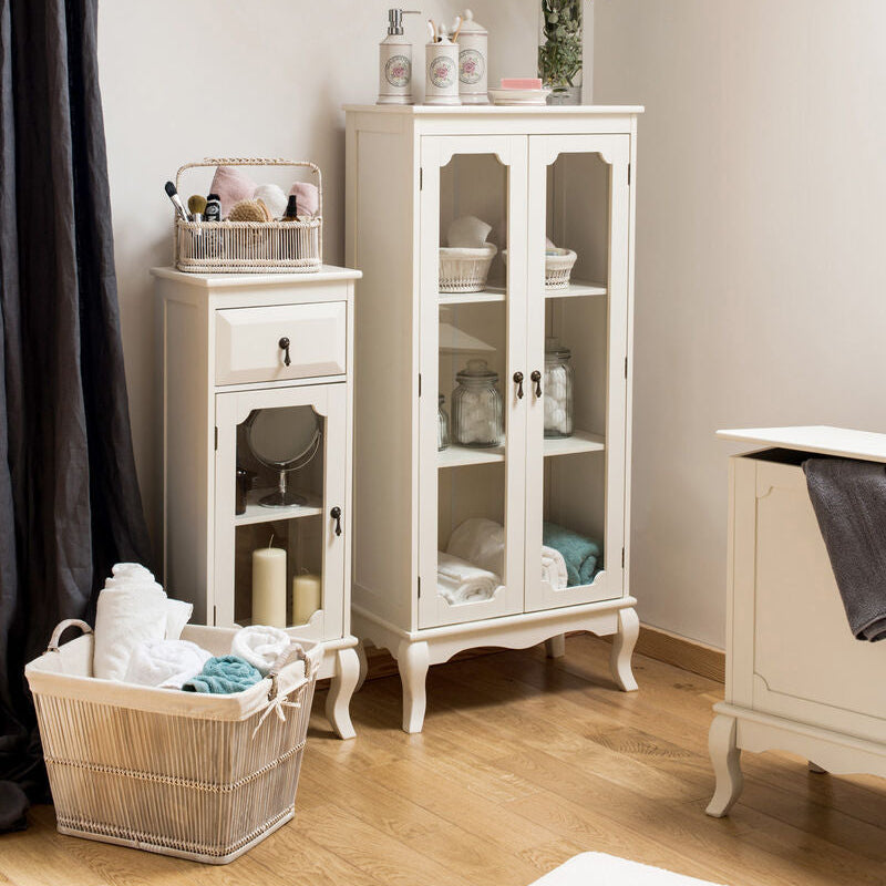 White cabinet with decorative items in a room setting