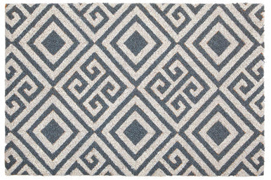 Patterned rug with geometric design on a white background