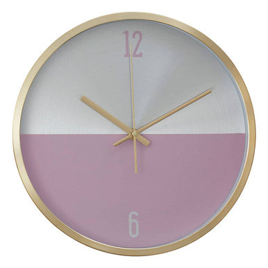 Round wall clock with gold frame and gradient pink to gray face on a white background