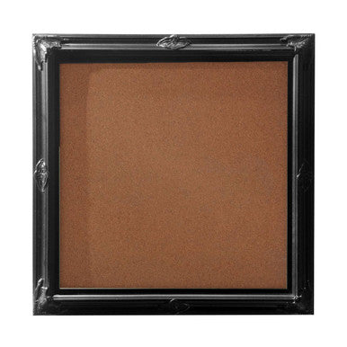 Brown powder in a black rectangular container with a silver lid on a white background
