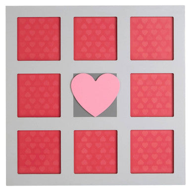 Set of pink heart-shaped makeup products in a grid on a gray background