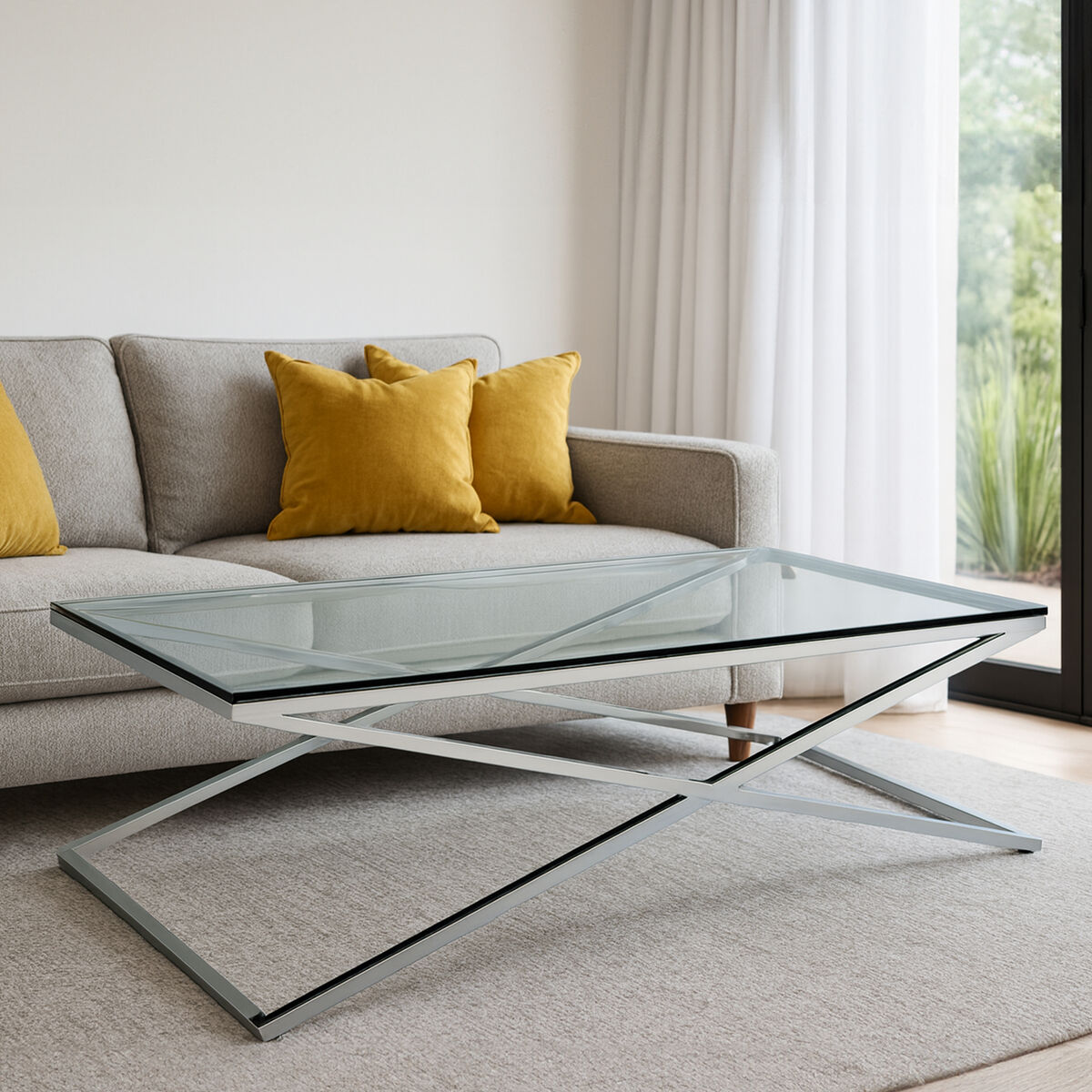 Glass coffee table in front of a gray sofa with yellow cushions in a living room.