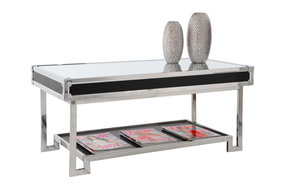 Coffee table with glass top and metal frame, featuring two decorative vases and magazines.