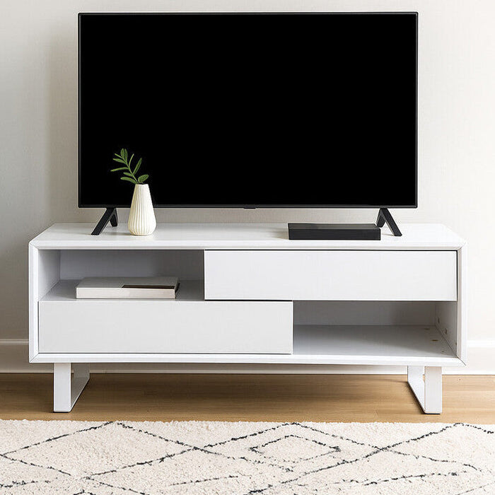 Modern white TV stand with a black flat-screen TV in a living room setting.