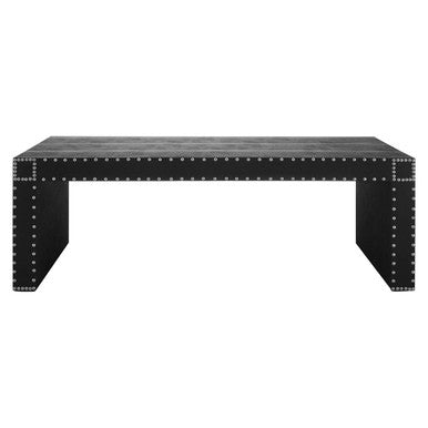Black metal table with rivet details on a white background