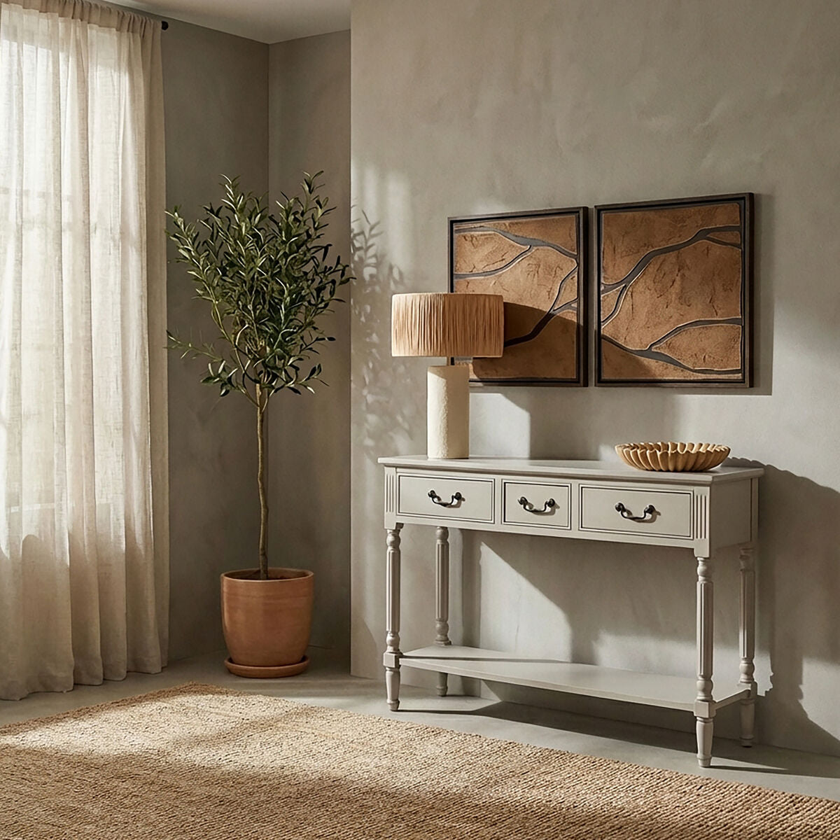 Living room with a console table, lamp, and decorative items against a wall with framed artwork.