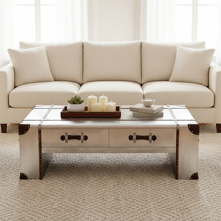 Beige sectional sofa with a wooden coffee table in a bright living room.