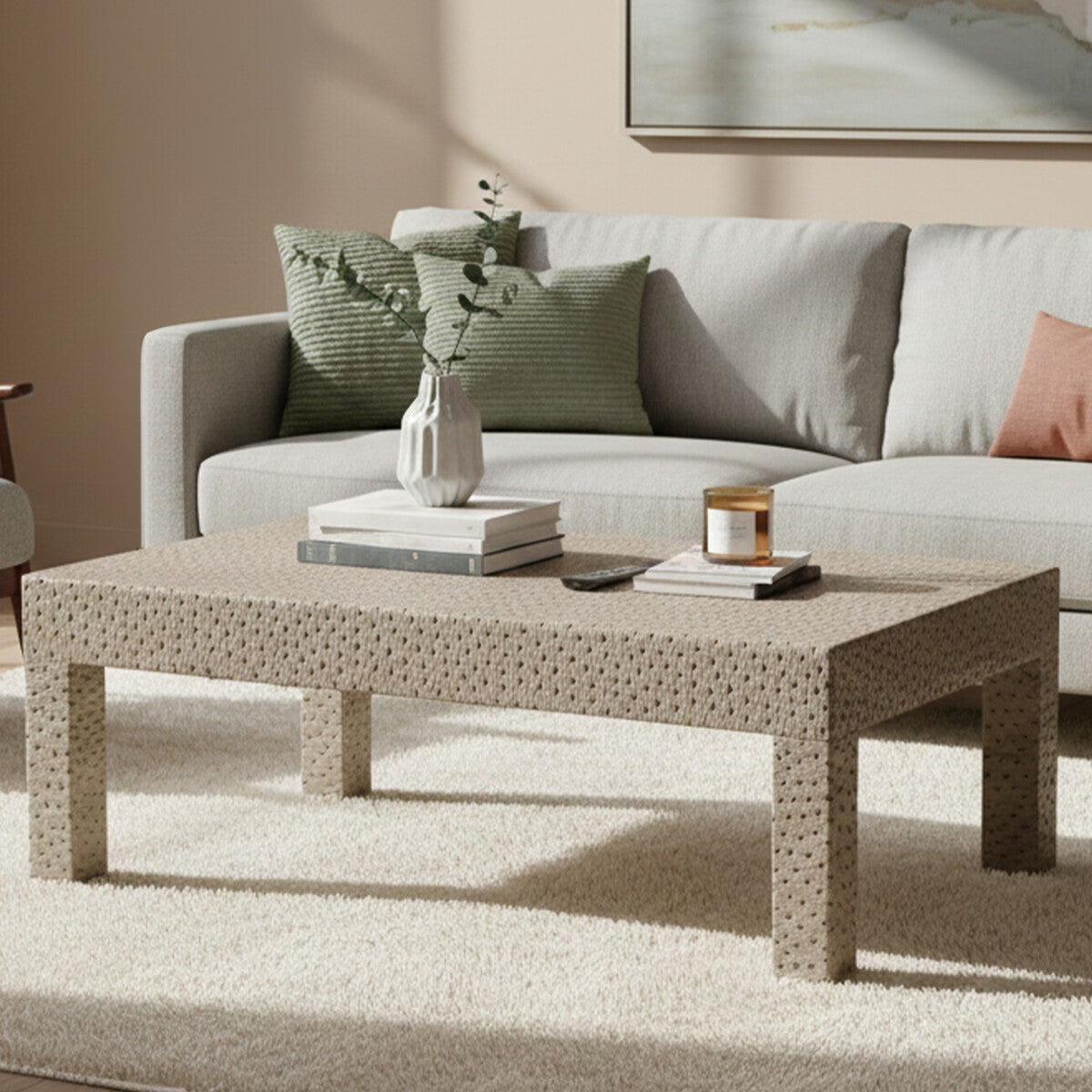 Living room with a gray sofa and woven coffee table