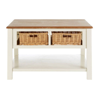 Wooden table with two wicker baskets on a white background