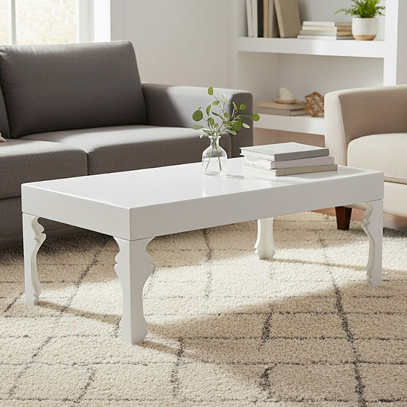 Modern living room with gray sofa, beige armchair, and white coffee table.