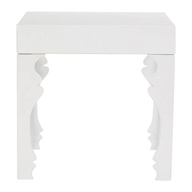 White decorative console table with intricate carvings on a white background