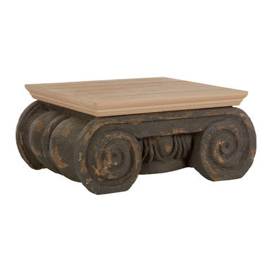 Wooden table with decorative metal base on a white background