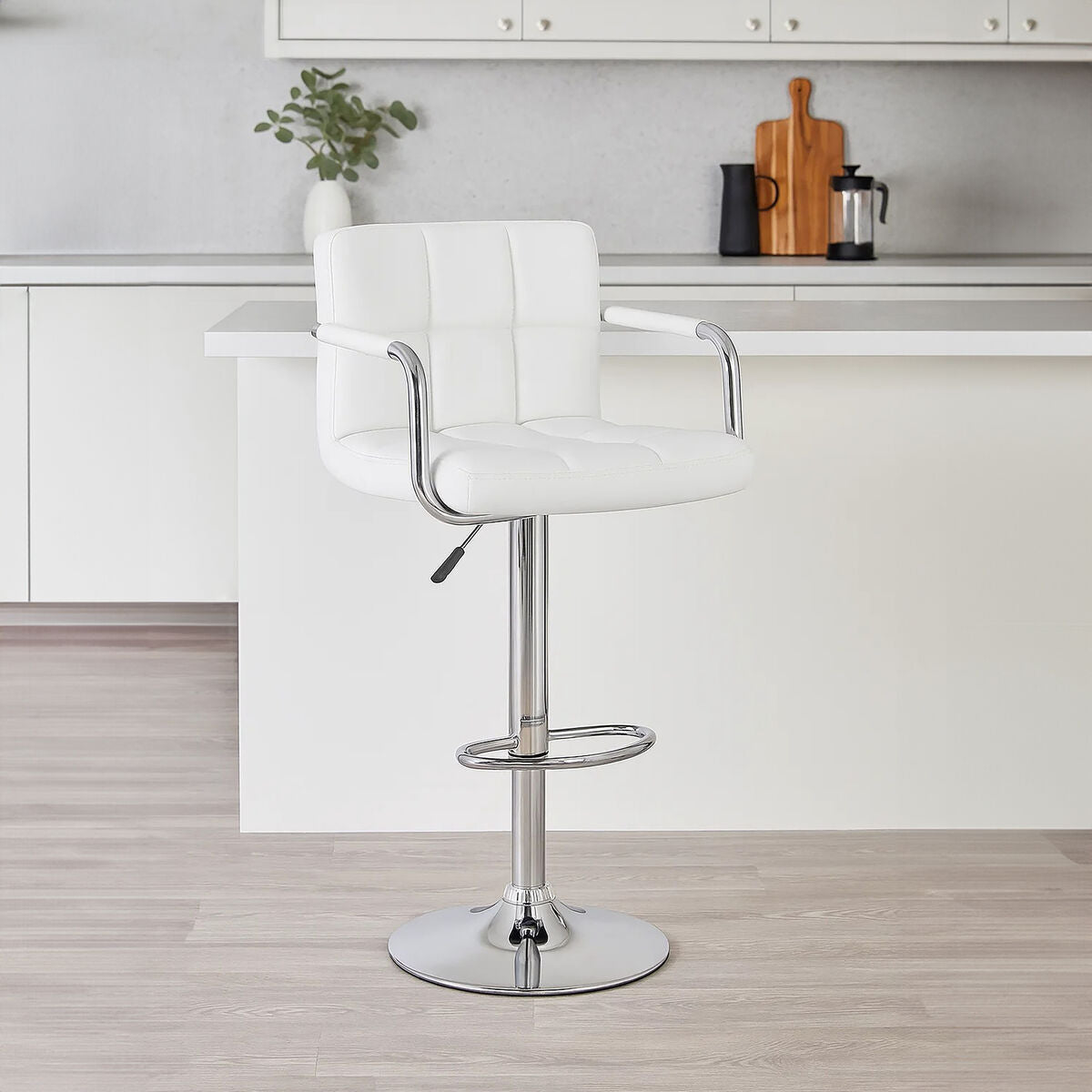 White bar stool with chrome base in a kitchen setting