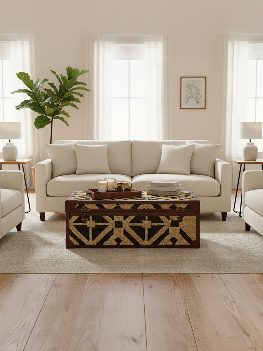 Living room with a beige sectional sofa, wooden coffee table, and decorative elements.