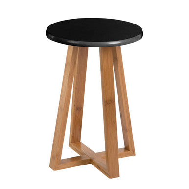 Stool with black top and wooden legs on a white background
