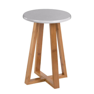 Small round table with a white top and wooden legs on a white background