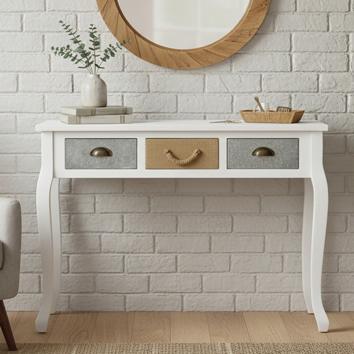 White console table with three drawers against a brick wall