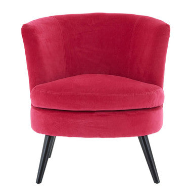 Red velvet chair with black legs on a white background