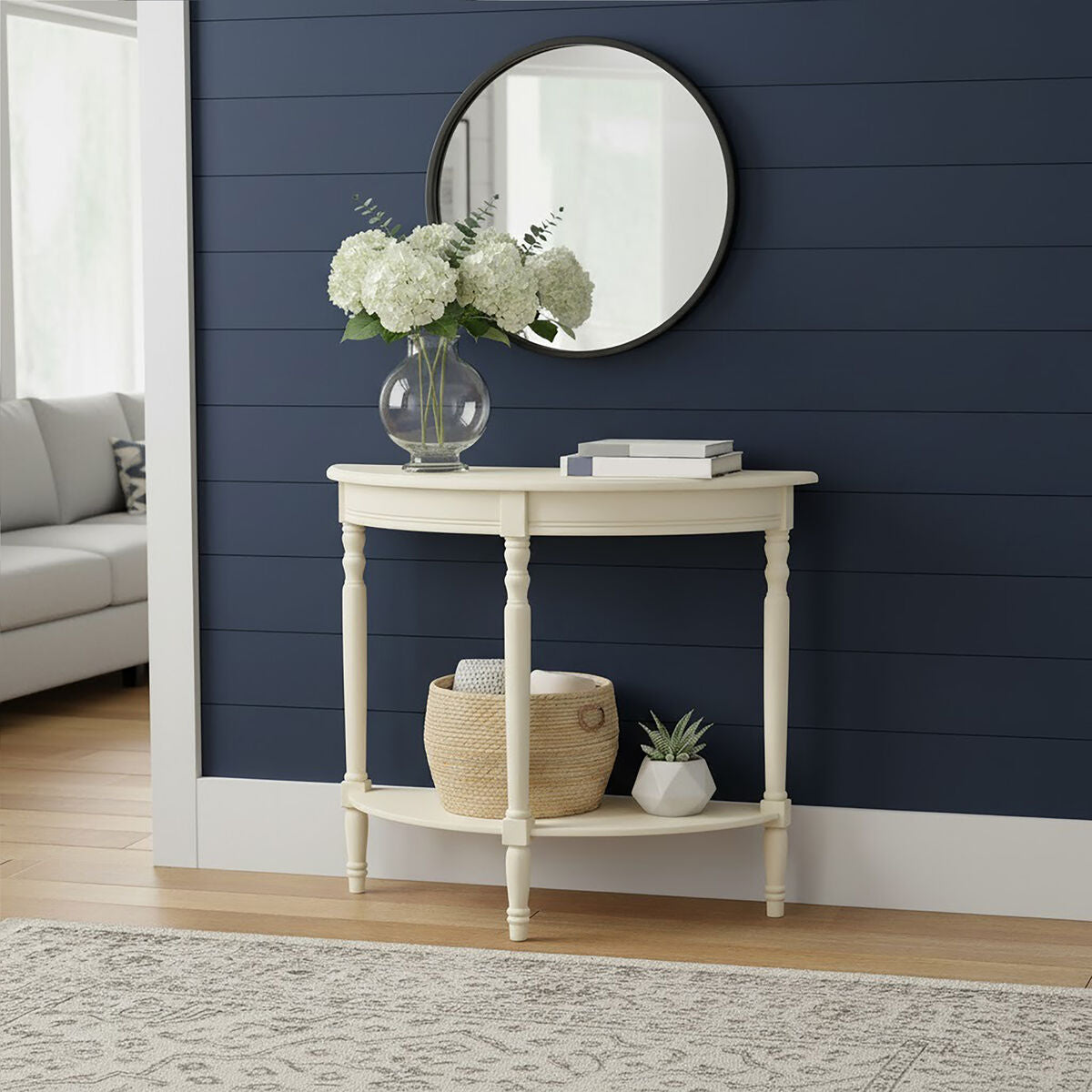 White console table with decorative items against a navy blue wall