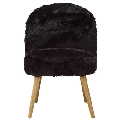 Black faux fur stool with wooden legs on a white background