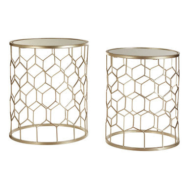 Two gold geometric side tables on a white background