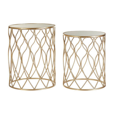 Two gold metal side tables with lattice design on a white background