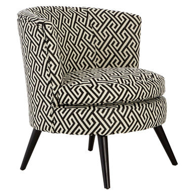 Patterned chair with black and white geometric design on a white background