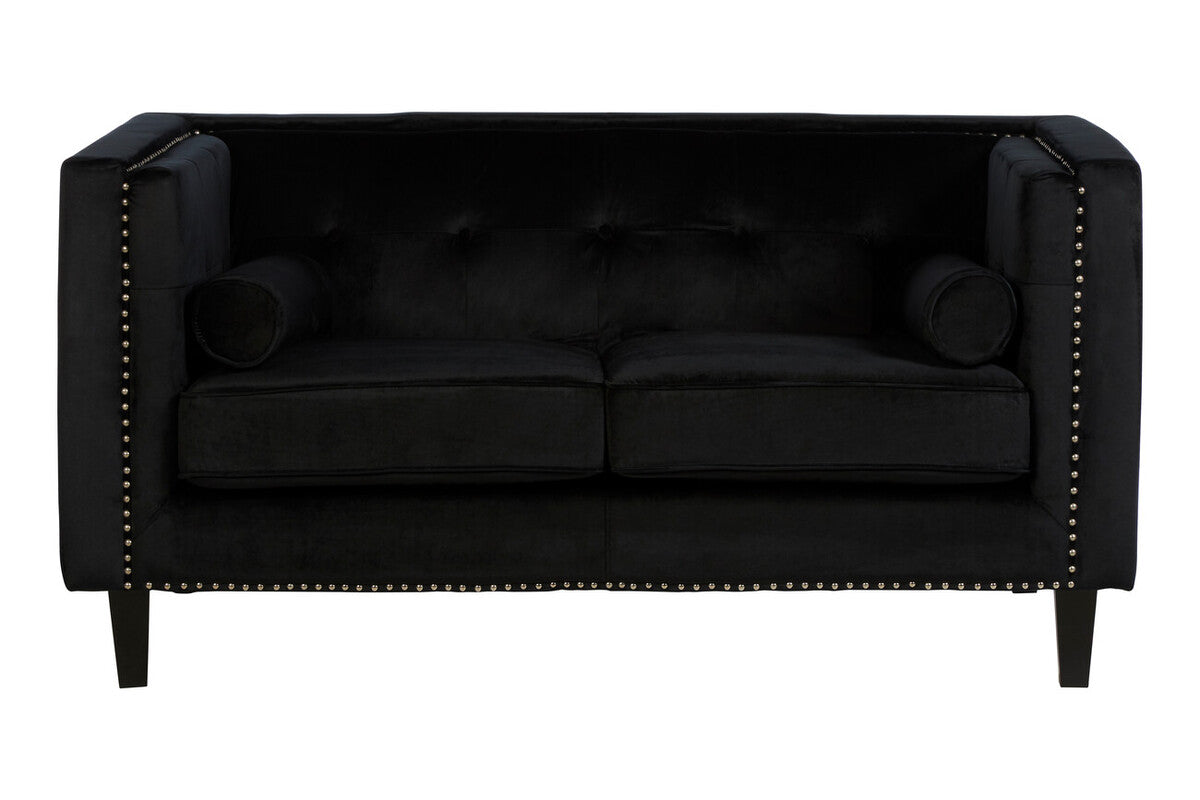 Black sofa with tufted backrest and nailhead trim on a white background