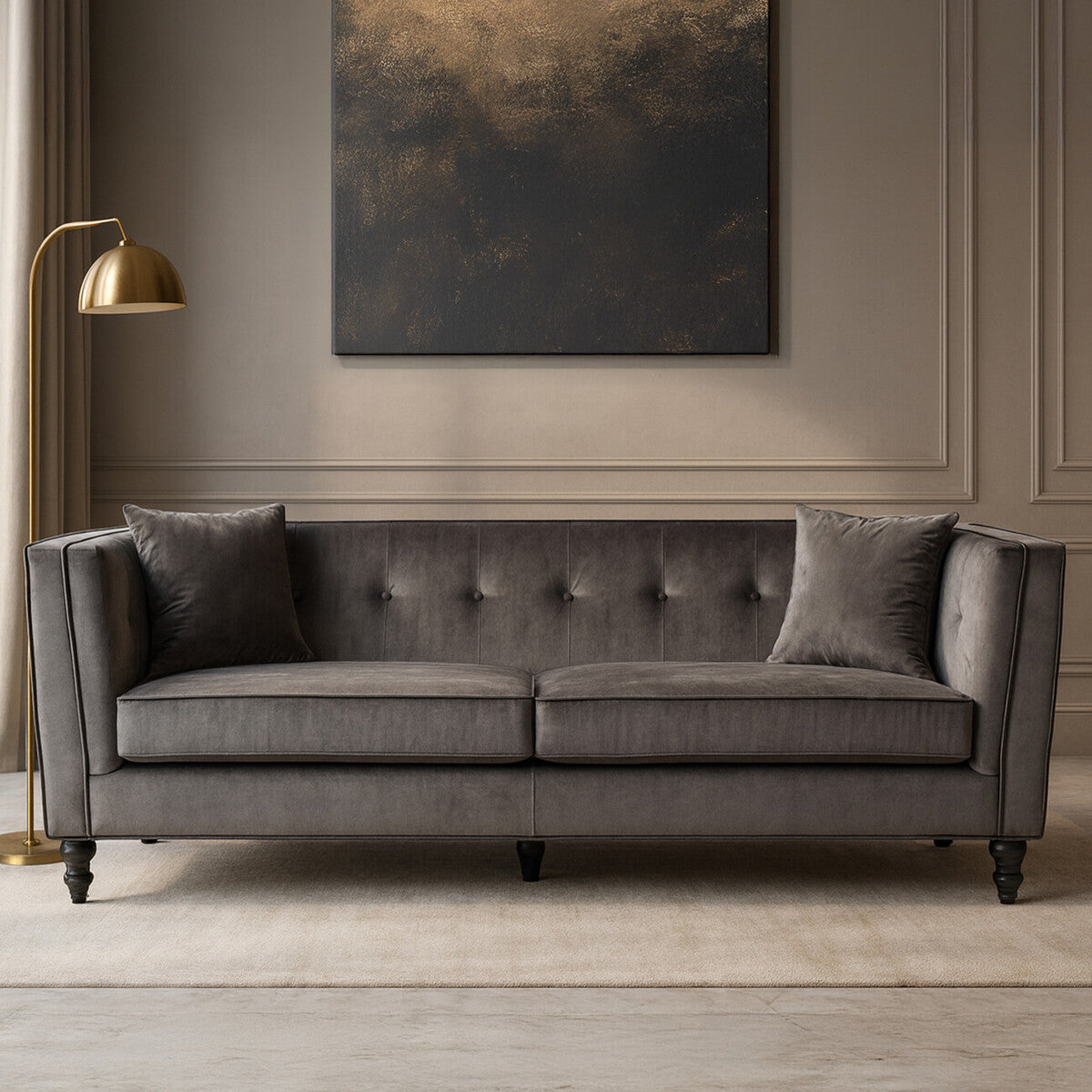 Gray sofa in a room with a gold lamp and abstract painting on the wall.