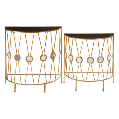 Two gold wire-framed side tables with black tops on a white background