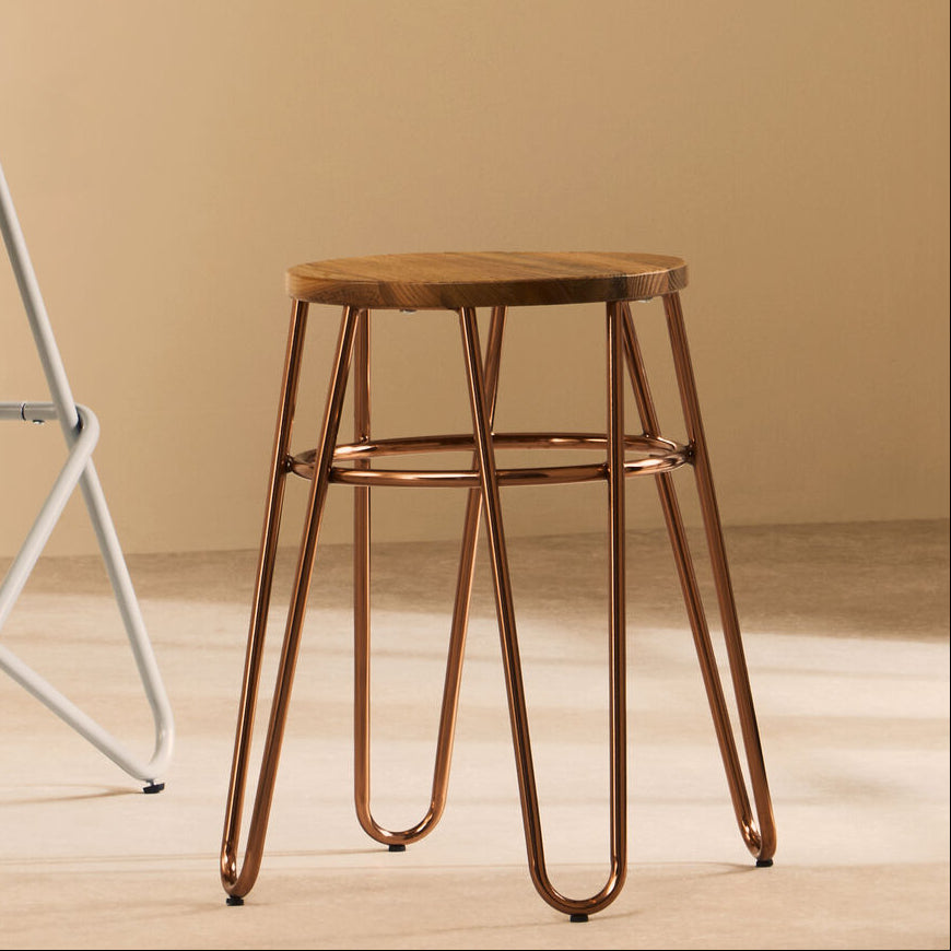Wooden stools with metal legs on a beige background