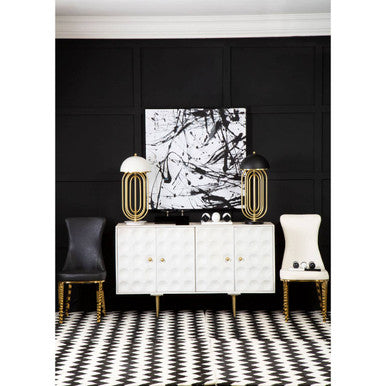 Modern interior design with black wall, white cabinet, and abstract art.