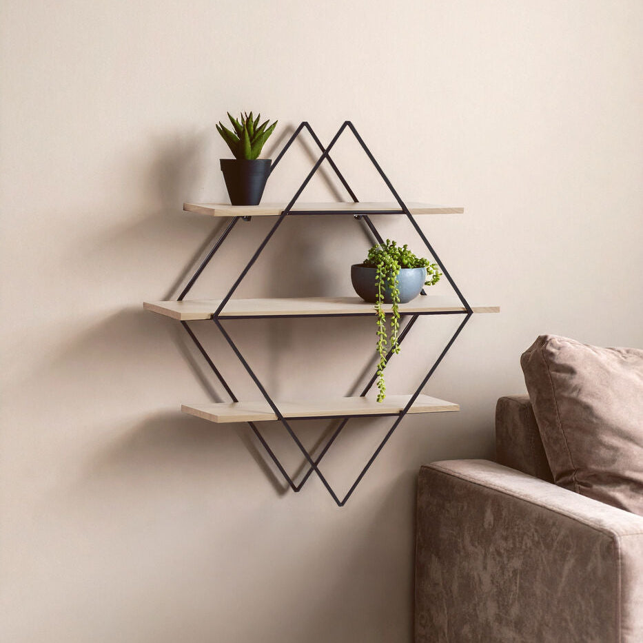 Geometric wall shelf with plants against a beige wall