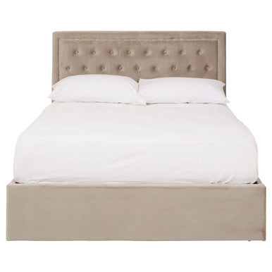 Beige upholstered bed with white bedding on a white background