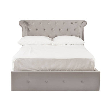 Gray upholstered bed with white bedding on a white background