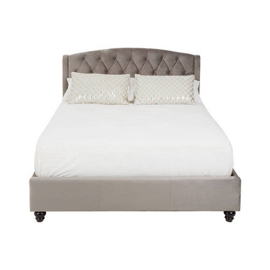 Beige upholstered bed with tufted headboard on a white background