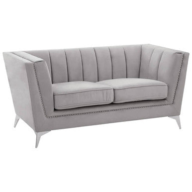 Gray tufted sofa on a white background