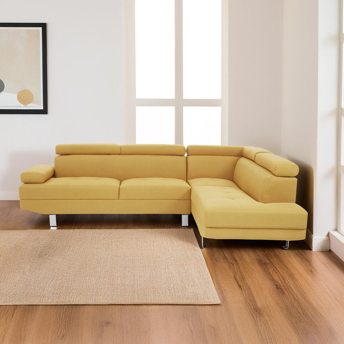 Yellow sectional sofa in a room with wooden flooring and a window.