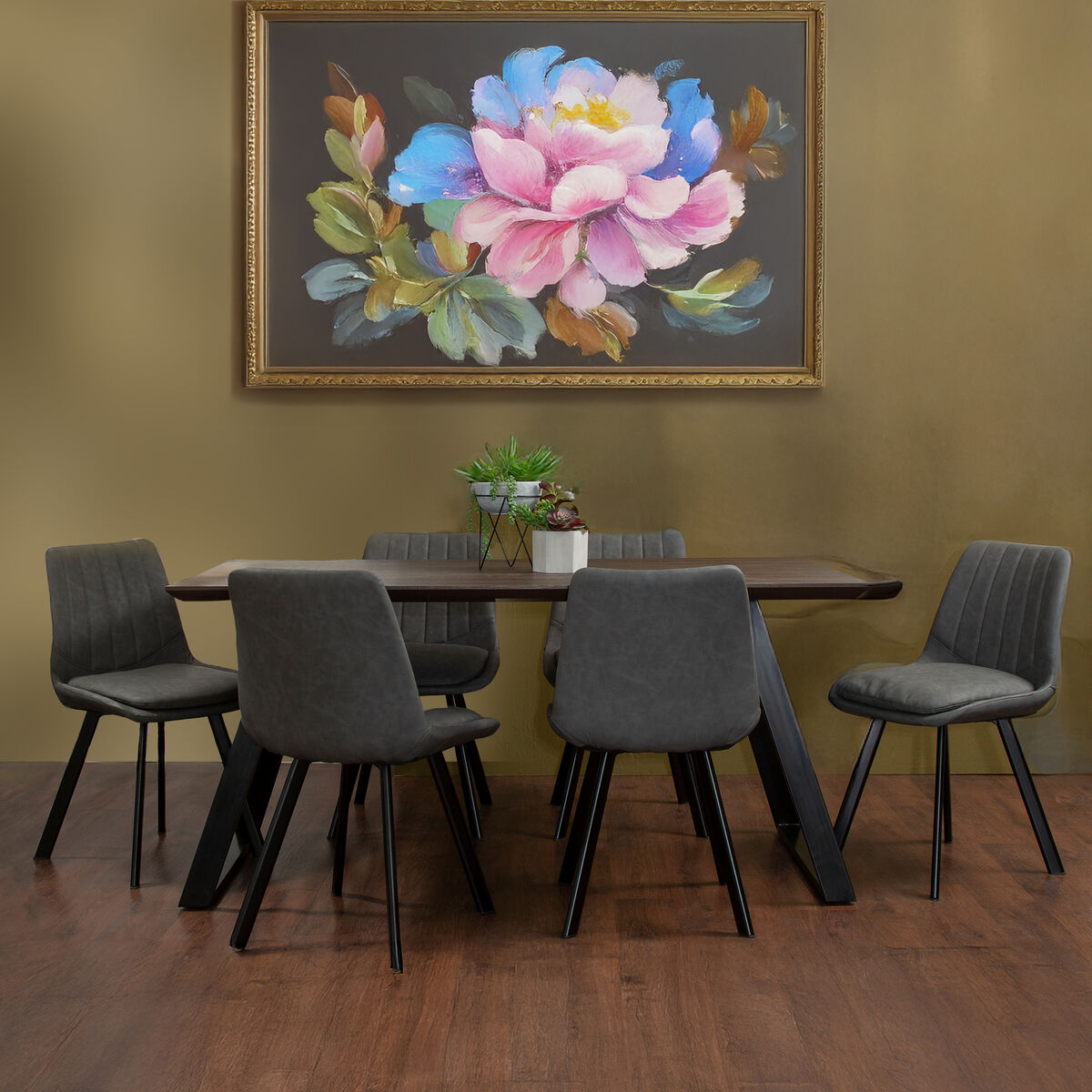 Dining room with a table and chairs, and a floral painting on the wall.