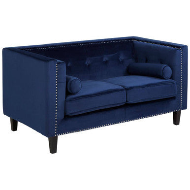 Blue sofa with nailhead trim on a white background