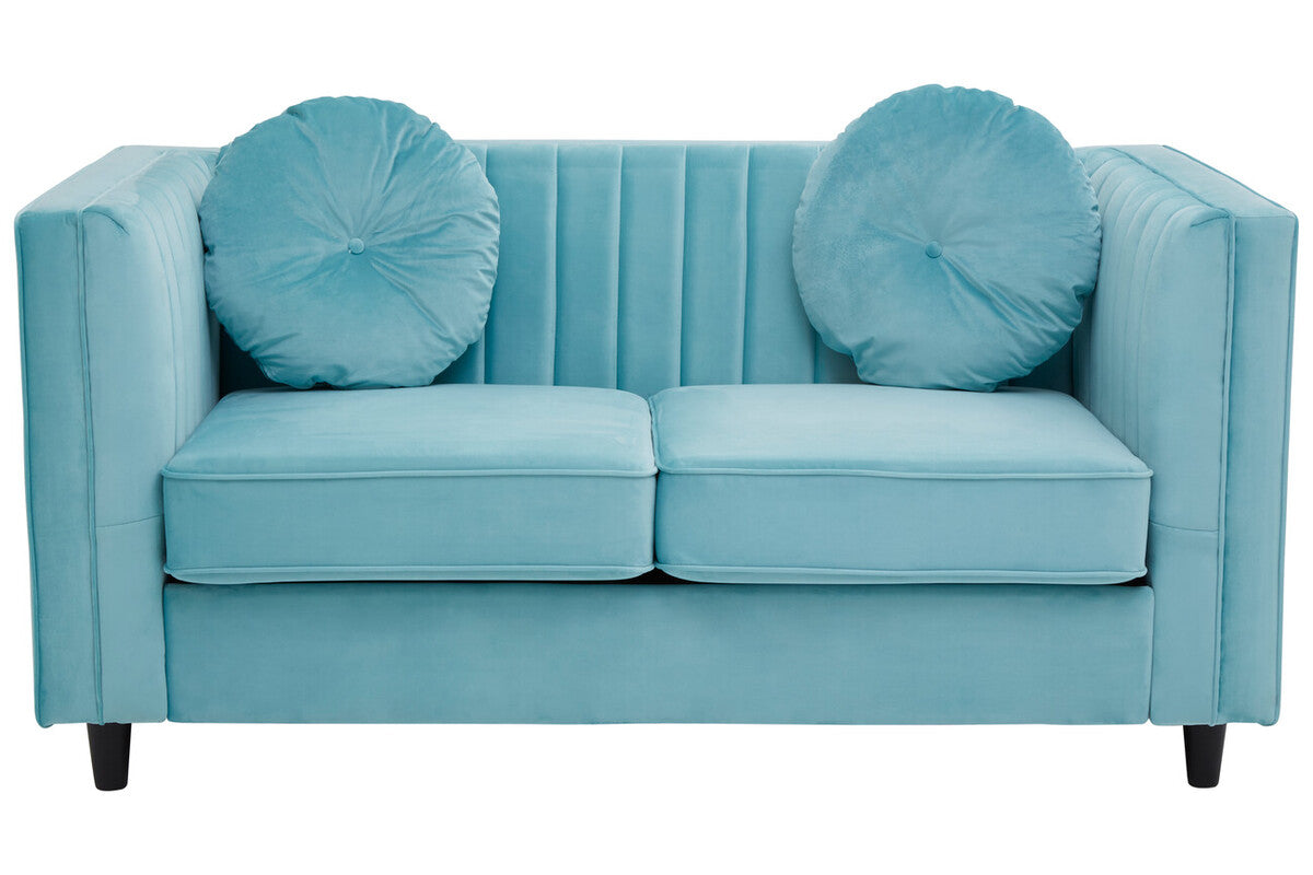 Blue sofa with round cushions on a white background