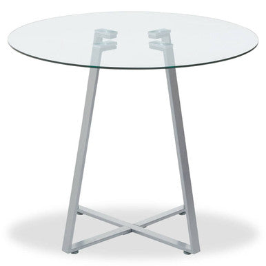 Round glass table with metal legs on a white background