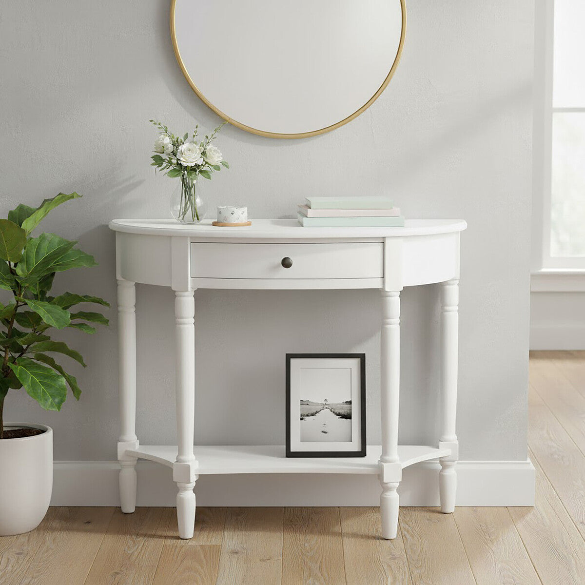 White console table with decor items against a light gray wall.