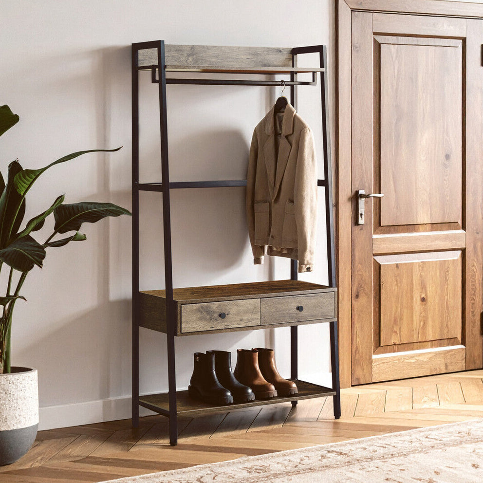 Foyer with a wooden coat rack, shoes, and a plant near a wooden door.