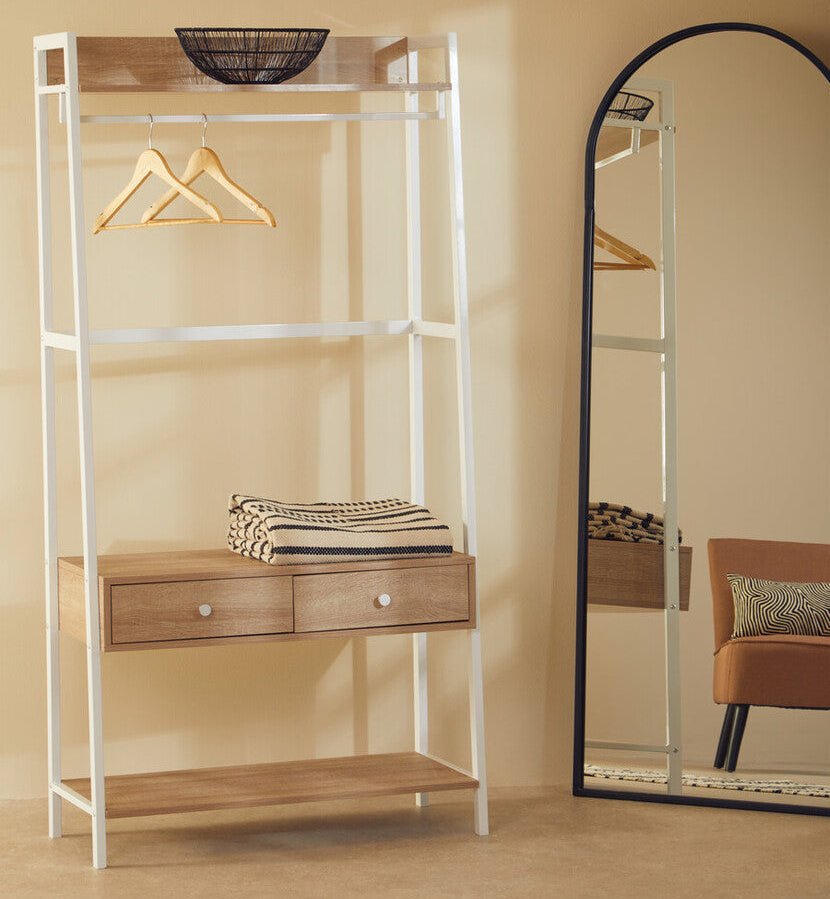 Shelving unit with wooden shelves and drawers next to a full-length mirror in a room.