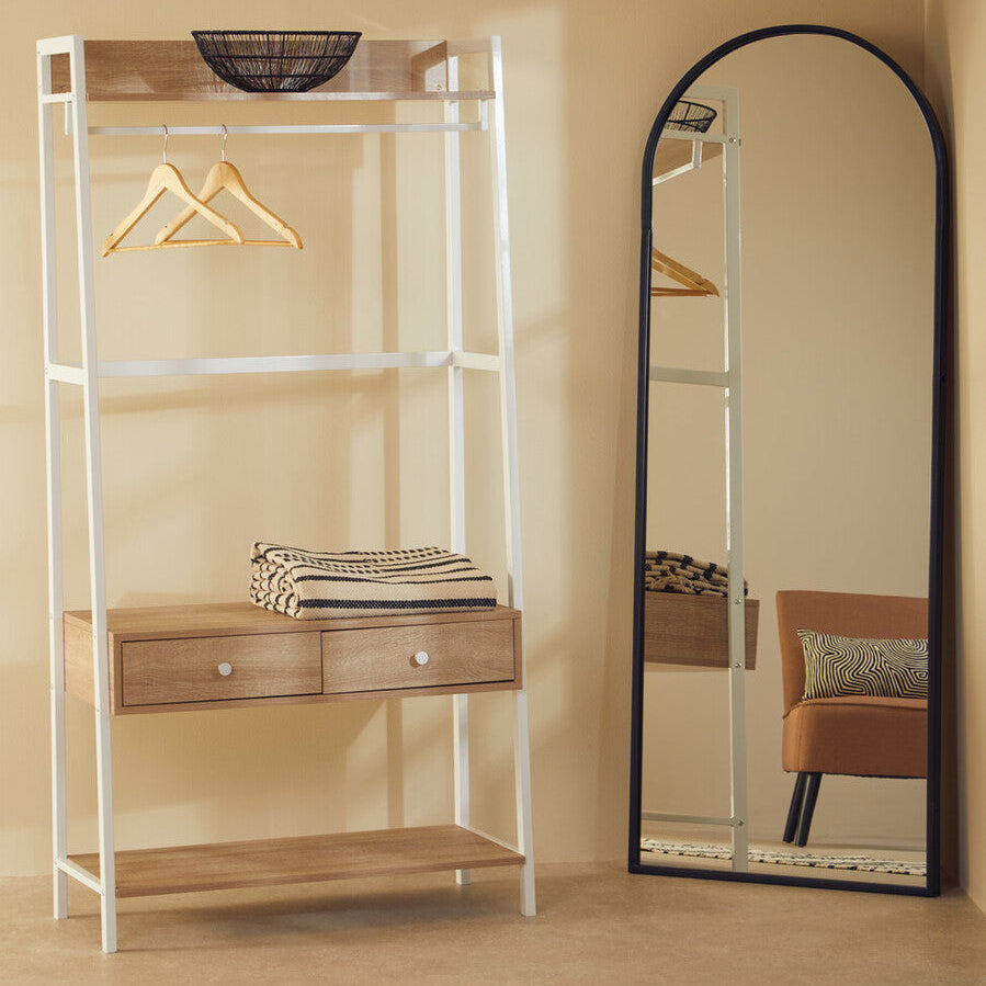 Shelving unit with wooden shelves and drawers next to a full-length mirror in a room.