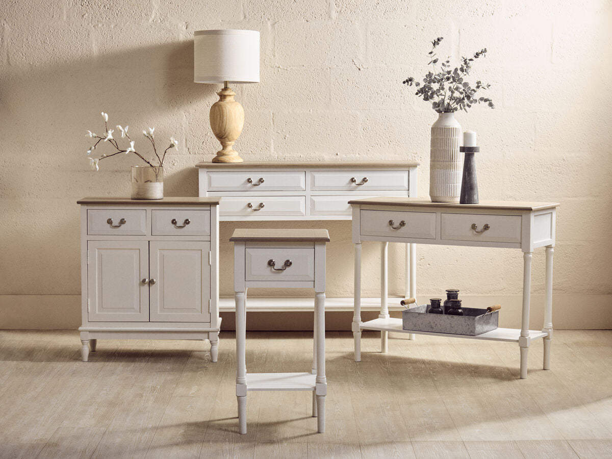 Set of wooden furniture including a sideboard, table, and bench in a room setting.