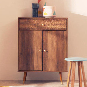 Wooden cabinet with decorative items and a stool in a room setting